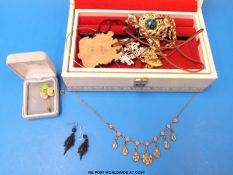 A collection of costume jewellery to include glass necklaces, brooches, faux pearls, earrings,