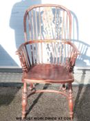 An elm and oak hoop back Windsor chair with pierced splat back