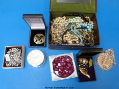 A collection of costume jewellery to include glass beads, earrings,