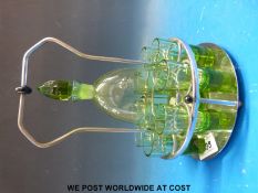 An Art Deco green glass absinthe set comprising fluted decanter and eight shot glasses all on a