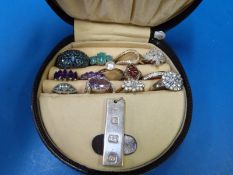 Thirteen silver rings set with various stones including amethyst and cubic zirconia and a silver