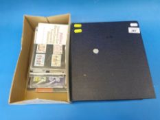 An album of PHQ cards and a box of presentation packs