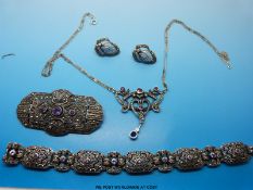 A silver suite of jewellery to include bracelet, necklace,