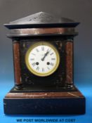 A two-train mantel clock striking on a gong with Roman numerals and 