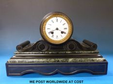 A black slate drum cased mantel clock with two train movement and Roman numerals