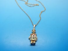 A 9ct gold pendant in the form of a clown set with sapphires,