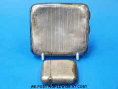 A hallmarked silver cigarette case together with a silver vesta case (weight 162g)