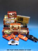 A collection of Burago, Corgi and other diecast model vehicles, some in original boxes.