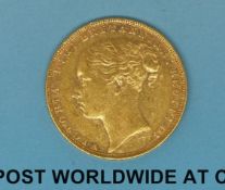 An 1880 young head gold full sovereign,