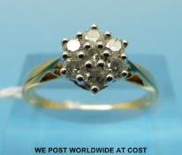 An 18ct gold ring set with diamonds in a cluster (size P)