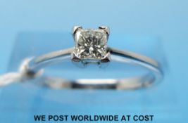An 18ct white gold ring set with a princess cut diamond measuring approx 0.