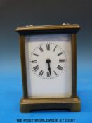 A brass cased carriage clock with white enamel dial together with a quantity of assorted clock and