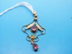 An Edwardian pendant marked 9ct set with pink topaz