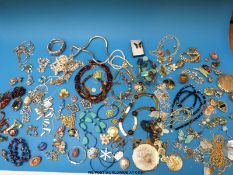 A large collection of costume jewellery to include silver, necklaces, micro mosaic,