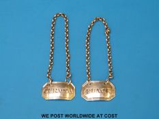 A pair of Victorian hallmarked silver miniature bottle labels for Punch and Curacoa, Ldn 1861,