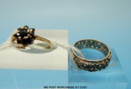 A 9ct gold ring set with sapphires in a cluster and a 9ct gold ring set with spinel
