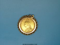 A Victorian 1891 gold full sovereign in yellow metal mount marked 14K (11.