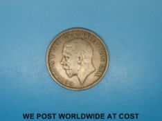 A 1928 George V crown with wreathed crown reverse, VF.