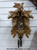 A c1945 wall cuckoo clock with finial, stamped 