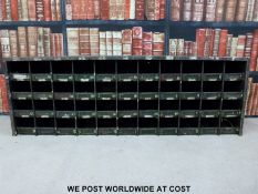 A vintage set of shopfitting / haberdashery / engineer's metal cubby holes with brass ticket