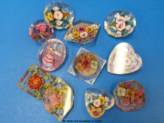 Eleven lucite brooches in various floral designs and various shapes