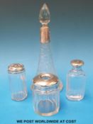 Four glass dressing table bottles,