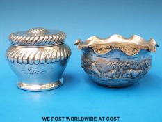 An Indian white metal bowl decorated with lions and elephants (diameter 11.