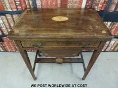 A late 19thC rosewood games table, the fold over top having chess,