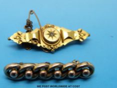A 9ct gold brooch set with a diamond and a 9ct gold brooch