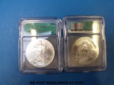 Two USA eagle silver dollars in perspex slabs 'MS69 grade' 2003 and 2006