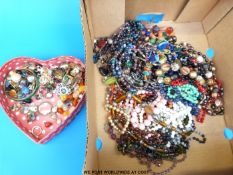 A large collection of beads and earrings to include agate, glass,