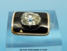 A Victorian yellow metal brooch set with an old mine cut diamond measuring approximately 2.