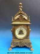A late 19thC brass mantel clock with enamel dial and two-train movement.