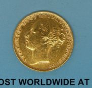 An 1880 young head gold full sovereign,