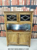 A 19thC walnut sideboard with two glazed doors with bevelled glass,