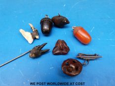 A small quantity of carvings to include a carved mouse, a beetle, a ram, two carved acorns,