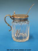 A Victorian hallmarked silver-mounted glass cruet with scrolling handle and thumbpiece, Ldn 1856,