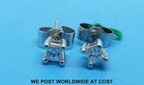 A pair of 9ct white gold earrings set with a round brilliant cut diamond to each