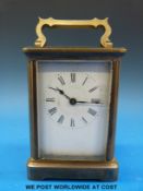 A French carriage clock with Roman numerals,