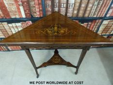 A late 19thC rosewood inlaid fold over triangular table (H75, W91,