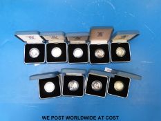 Nine silver proof UK one pound cased coins with certificates 1983-1989,