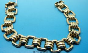 A 9ct gold bracelet made up of rectangular 'buckle' links (22.