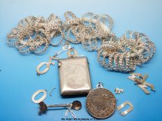 A collection of white metal charms in the form of letters, hallmarked silver vesta,