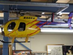 A remote control petrol helicopter with Hitec Aurora 9 2.4  Ghz transmitter, engine fitted is an O.