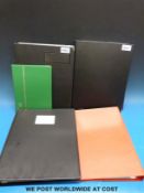 Four ring binders and a stockbook of GB stamps.