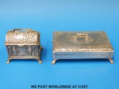 A continental white metal trinket box with swing handle raised on four paw feet (width 13cm)