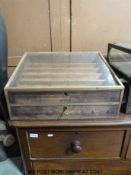 A wooden Superdry counter top shopfitting cabinet (H25 x W52 x D42cm)