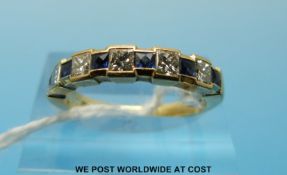 An 18ct gold ring set with square cut sapphires and alternating diamonds (size N)