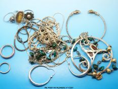 Nine silver/white metal necklaces, a pair of amber and silver earrings, four silver rings,