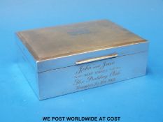 A hallmarked silver cigarette box with engine turned lid (width 11.